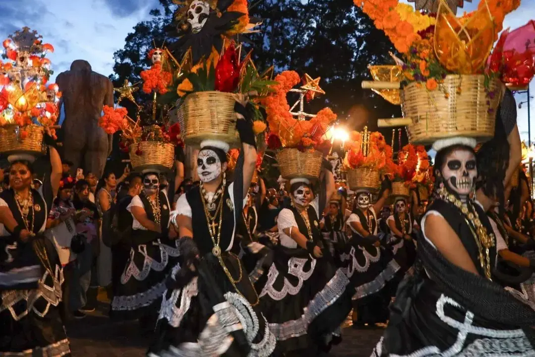 A china oaxaqueña with Catrina face paint during a parade in the Historic Center of Oaxaca City. Photo by Carolina Jiménez Mariscal / Cuartoscuro. A china oaxaqueña with Catrina face paint during a parade in the Historic Center of Oaxaca City. Photo by Carolina Jiménez Mariscal / Cuartoscuro.